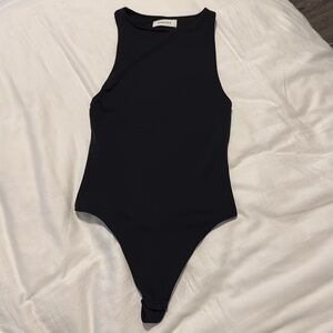 Babaton 2xs black onesie - good condition